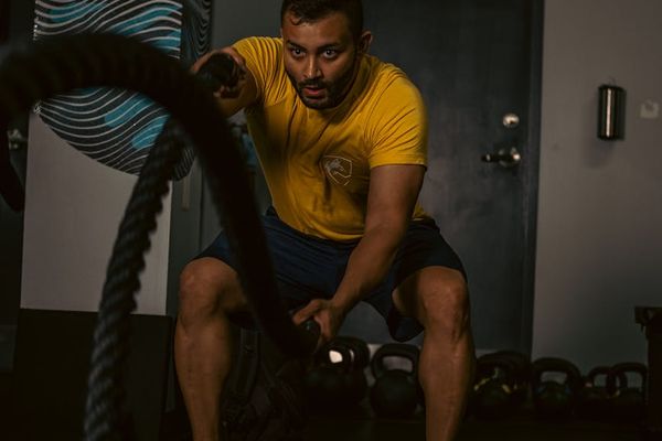 Man in athletic wear focusing before a workout session.
